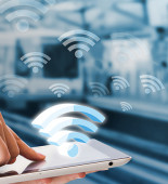 Businesswoman connecting to Wifi