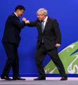 Prime Minister Boris Johnson greets Ukhnaa Khurelsukh, President of Mongolia, on arrival to COP26 World Leaders Summit