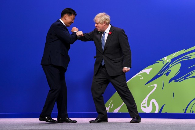 Prime Minister Boris Johnson greets Ukhnaa Khurelsukh, President of Mongolia, on arrival to COP26 World Leaders Summit